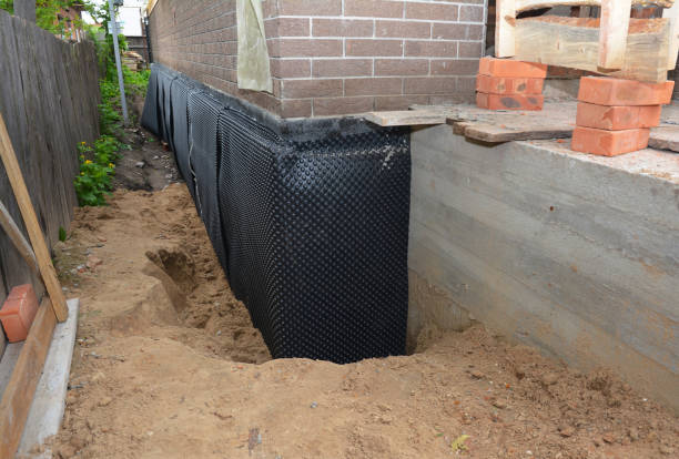 SJ Waterproofing Pros technician performing targeted Exterior Waterproofing assessment in Ortonville, MN